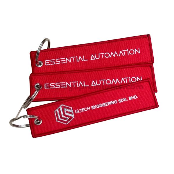 Custom embroidered keychains with logo and text, ideal for corporate branding, aviation tags, and promotional giveaways. Made with high-quality stitching for durability.