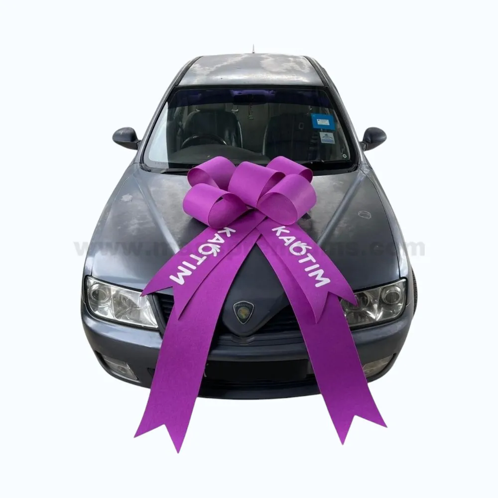Large purple new car ribbon bow with personalized printing displayed on a vehicle bonnet, ideal for car delivery ceremonies, showroom launches, vehicle gifting, and promotional events.