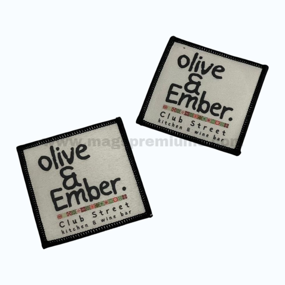 Custom woven patches with logo design and merrowed border, featuring high-detail branding for apparel, uniforms, caps, bags, hospitality businesses, corporate merchandise, promotional products, and fashion accessories.