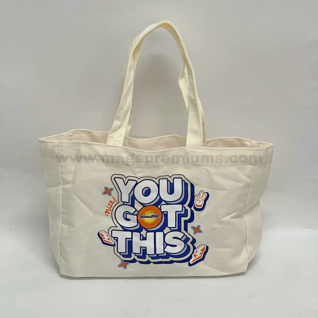 Custom eco tote bag with full colour logo printing on natural cotton canvas for reusable shopping bag and promotional giveaway merchandise