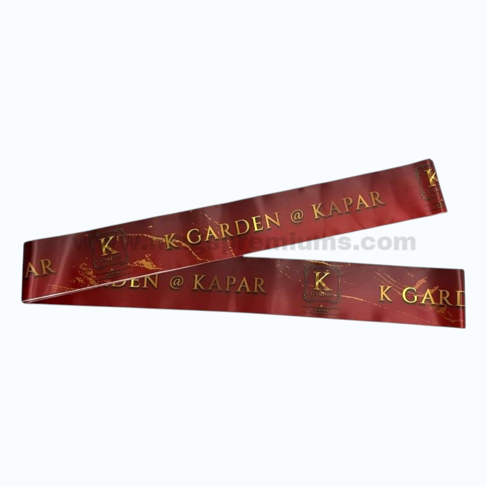 Custom printed ribbon for opening ceremony featuring premium maroon satin material with gold logo printing, suitable for shop openings, property launches, business inaugurations, and VIP events.