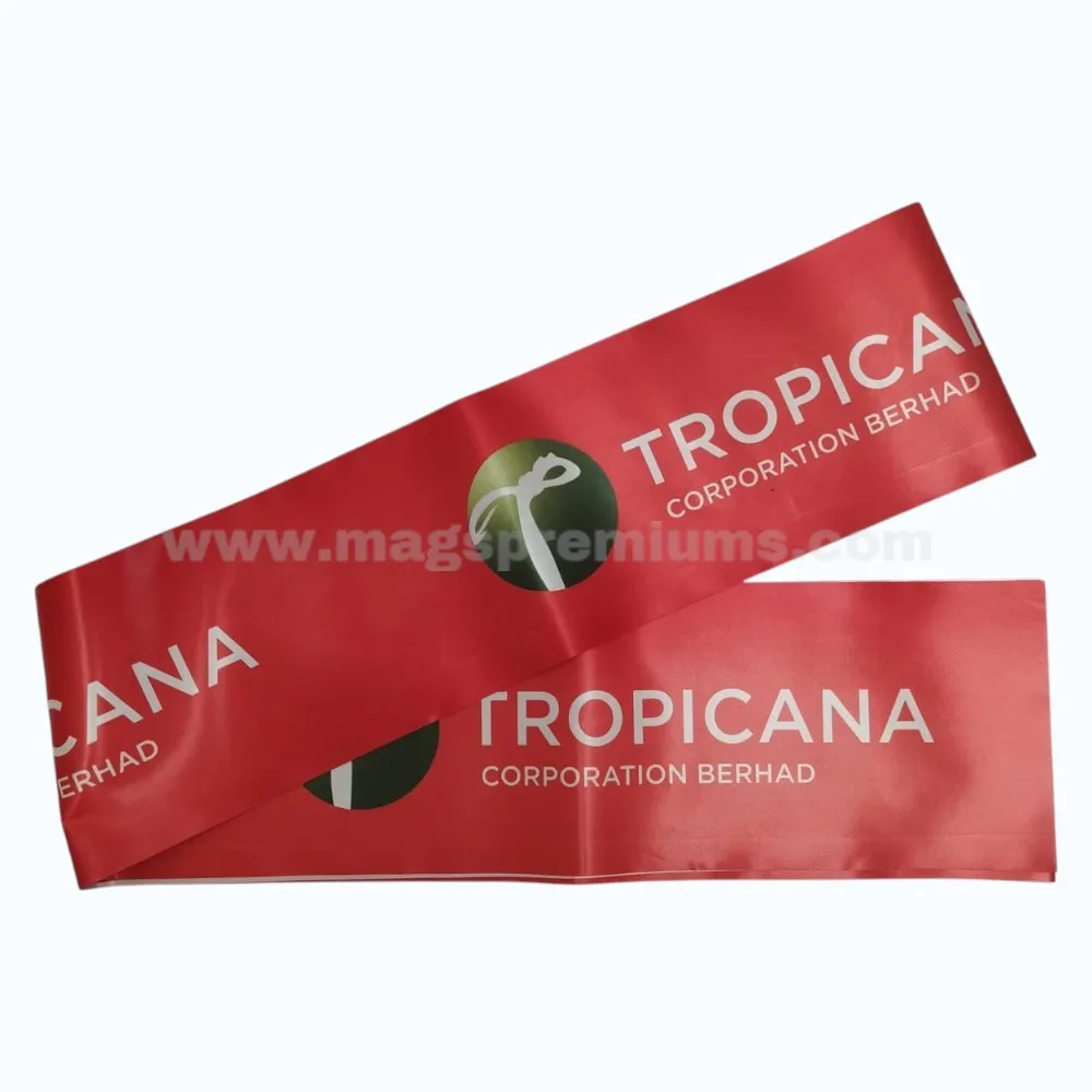 Red ribbon for opening ceremony with Tropicana Corporation Berhad logo and custom full-color printing.