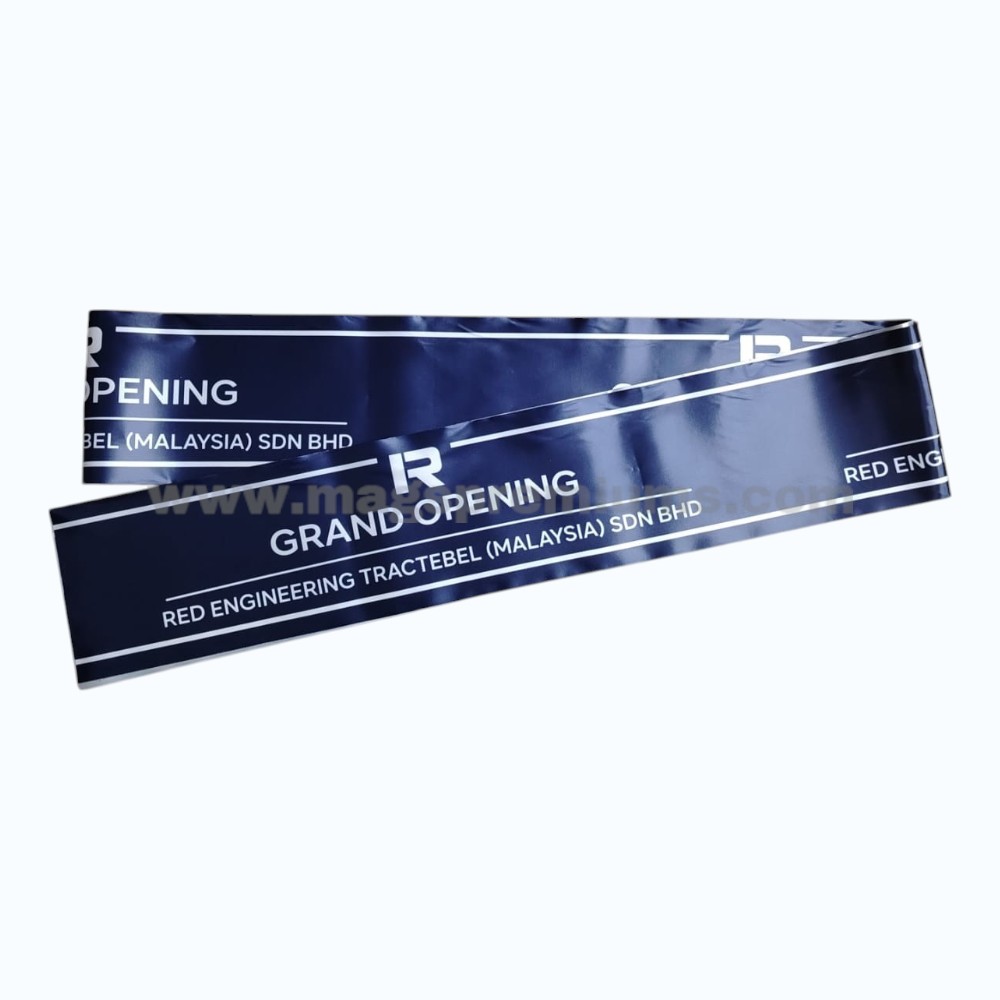 Blue ribbon for opening ceremony with Grand Opening text and custom company branding printed for corporate launch events.