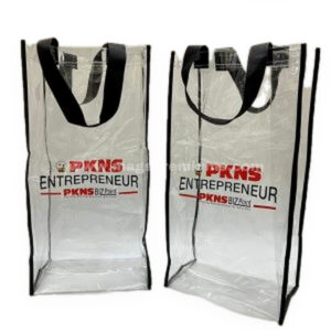 Clear PVC tote bags with black handles and red printing
