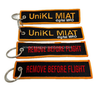 Orange and black fabric keychains with UniKL MIAT print