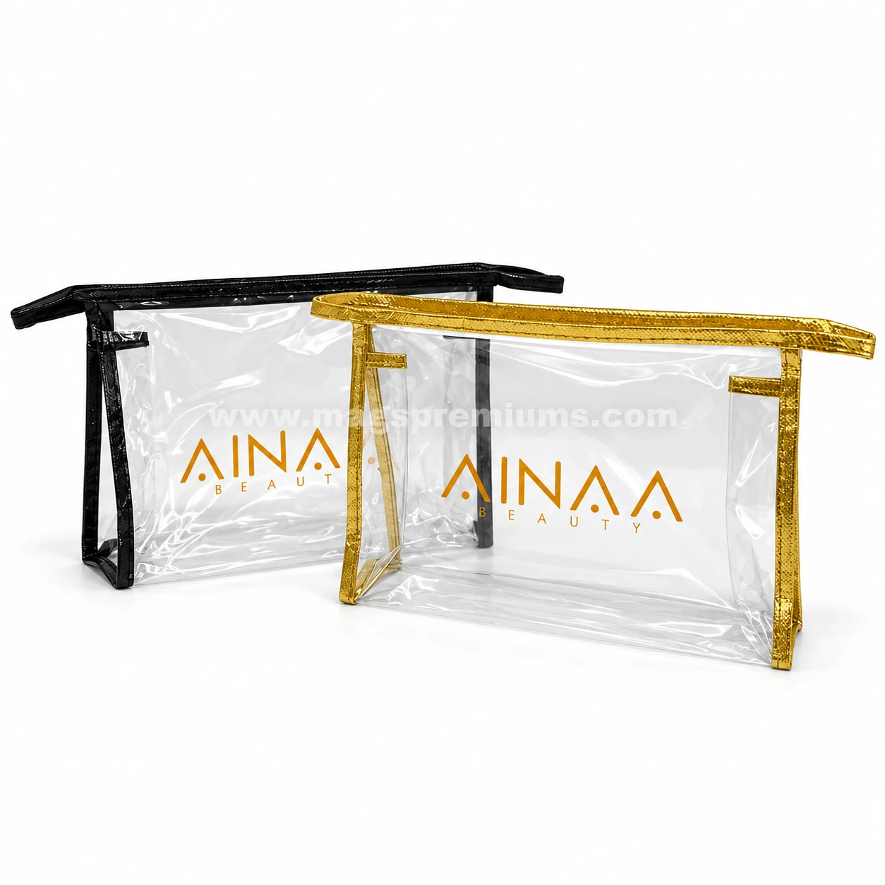 Clear PVC makeup bags with black and gold trim, printed with a beauty brand logo