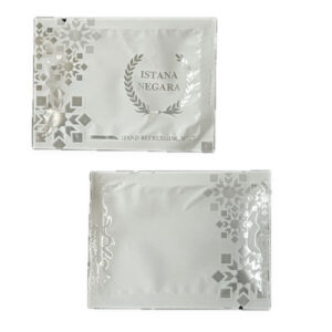 Two silver branded wet wipe sachets with decorative print