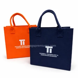 Custom felt tote bags in orange and navy with printed white company logo