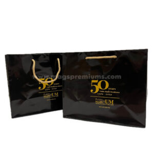 Black printed paper gift bags with gold handles