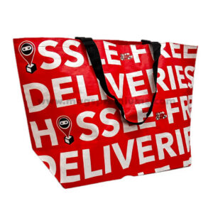 Red and white PP woven shopping bags with large printed design