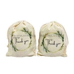 Cream printed drawstring pouches with green designs